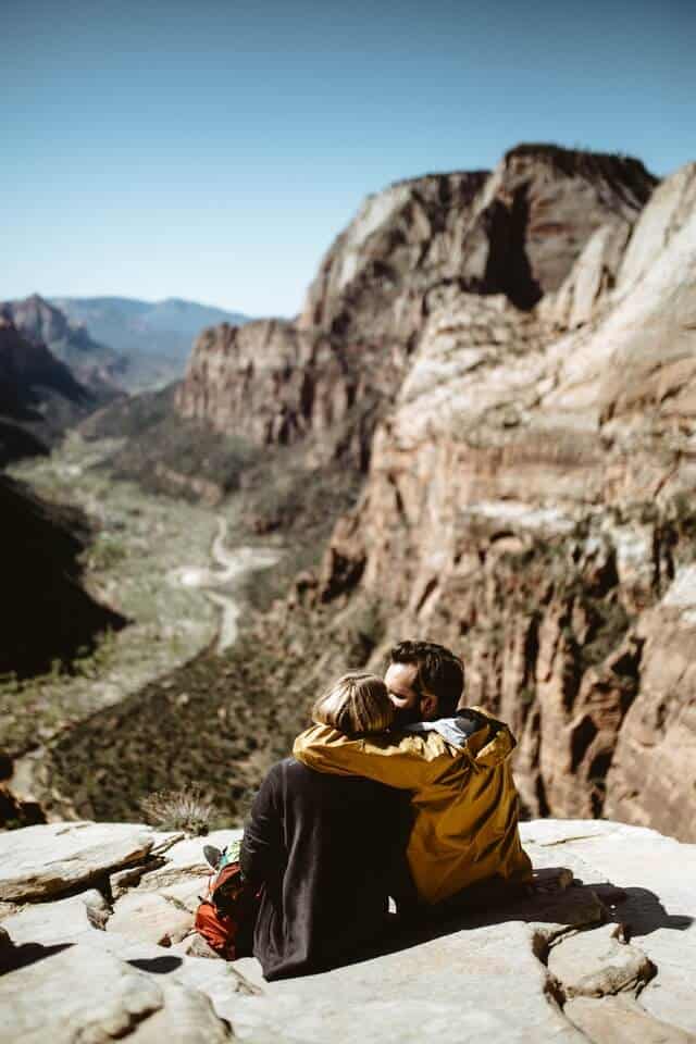 Couple Hiking On Mountain