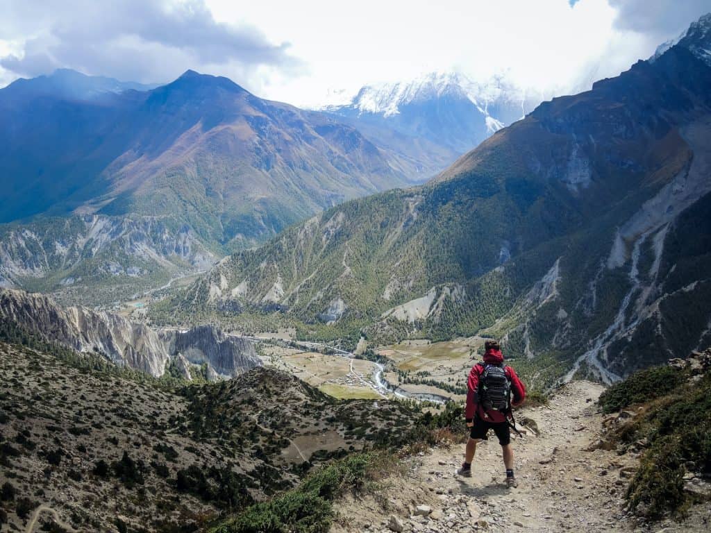 Man wearing hiking jacket on mountain